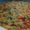 Piatto di risotto Pignolina con zucchine, carote, pomodoro e parmigiano