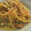 Tagliatelle con fiori di zucca e speck di Gioconda Citro