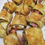 Involtini di zucchine ripieni e guarniti, piatto estivo sano e delizioso.